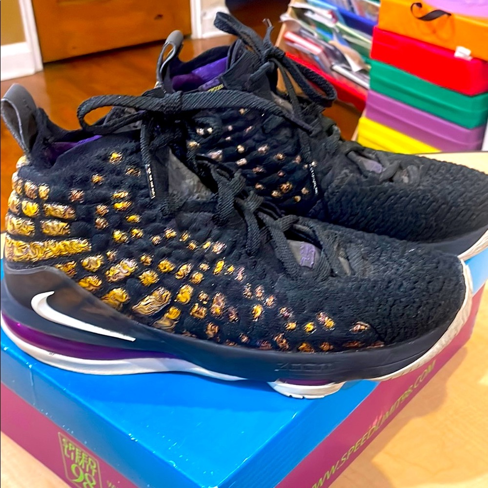 Nike Black and Gold Sneakers with Intricate Design